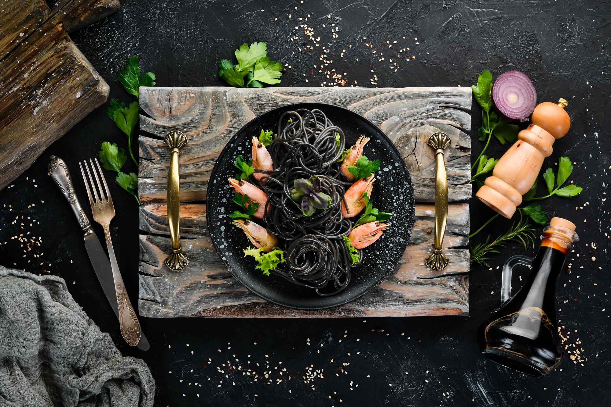 Assorted plated dishes on dark slate